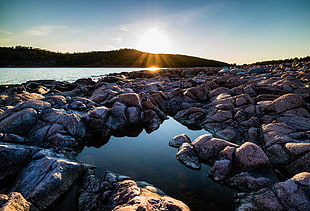 rocks on body of water during daytime