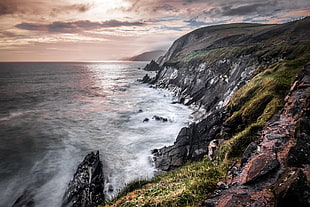 landscape photography of cliff and sea waves, kerry, ireland HD wallpaper