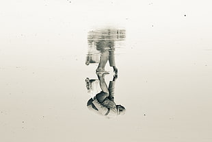grayscale photo of man holdign white plastic bag HD wallpaper