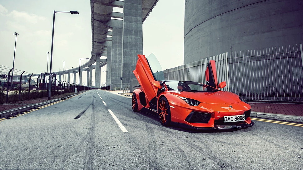 orange Lamborghini coupe, road, bridge HD wallpaper