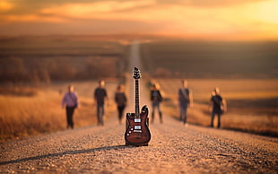 brown electric guitar on The road HD wallpaper