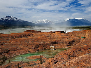 hot springs between brown rocks HD wallpaper