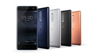 five assorted Android smartphones