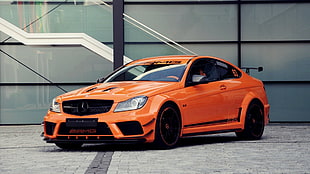 orange Mercedes-Benz coupe