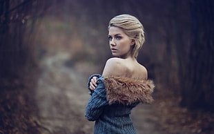 woman in brown and blue fur-line top