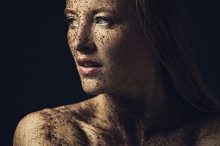 woman covered with dirt posing