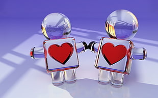 two human-shaped glass decors