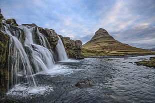 water falls near mountain photo in daytime