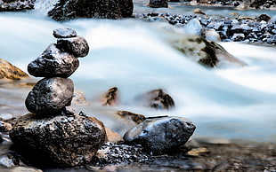 time lapse grey rocks beside river photography