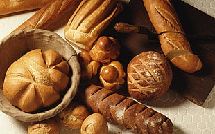 several assorted breads on top of the table