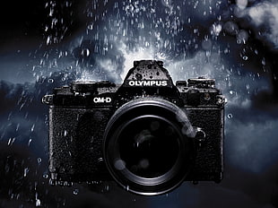 black Olympus OM-D camera in the rain HD wallpaper