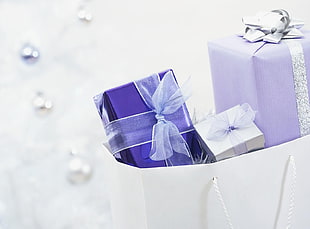 white and purple wrapped gifts