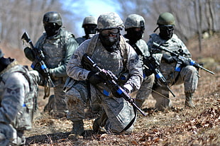 six soldier in forest during daytime