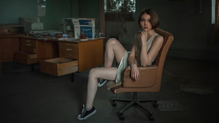 woman in white midi dress sitting on brown leather swivel chair HD wallpaper