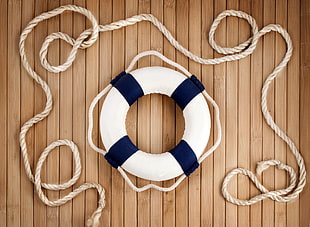 white and blue buoy, ropes, wood