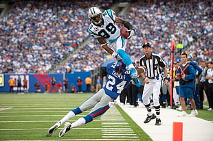 football player jump over player in 24 jersey HD wallpaper
