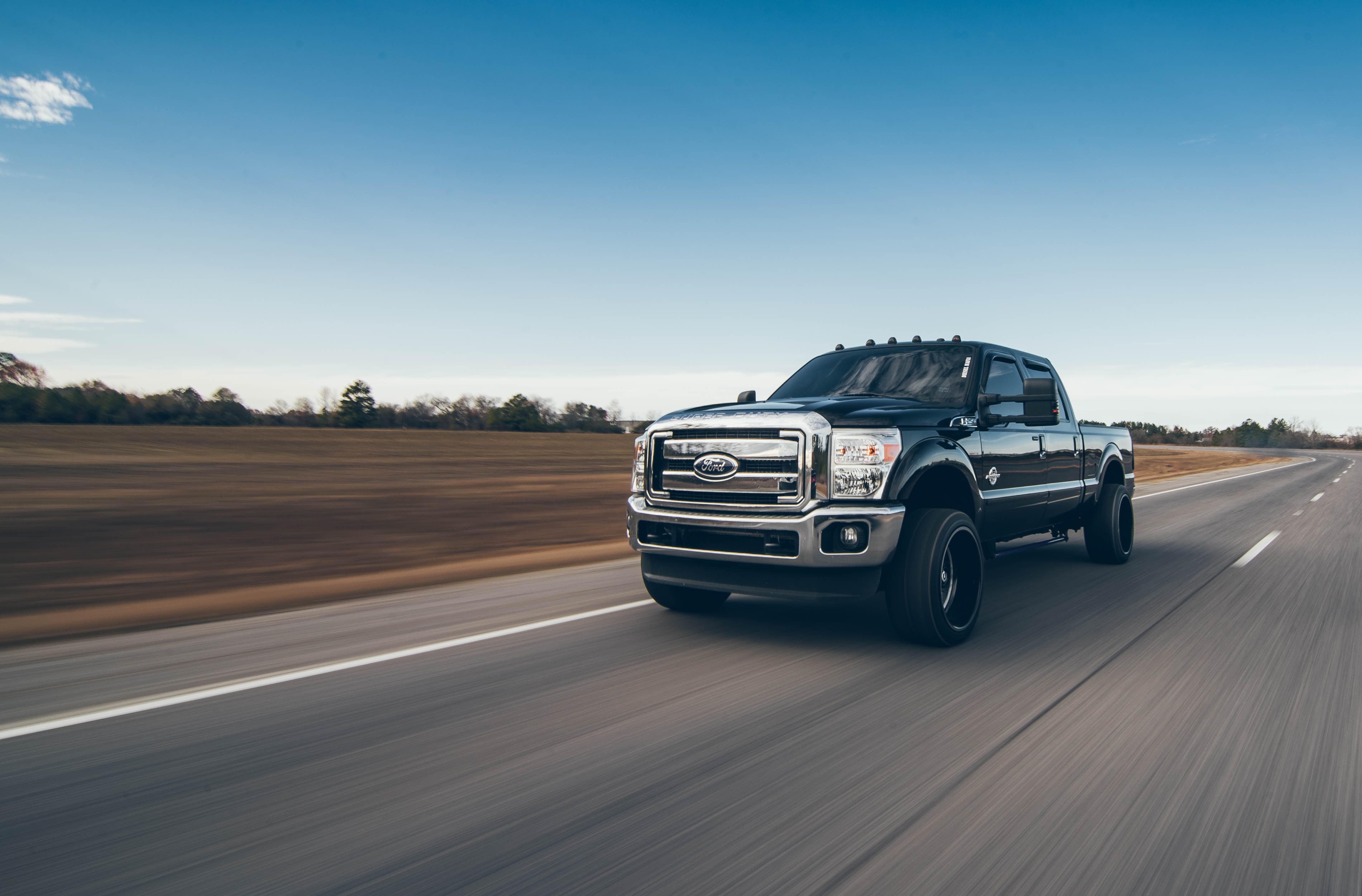 black Ford F-250 crew cab pickup truck