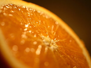 slice of round yellow citrus fruit HD wallpaper