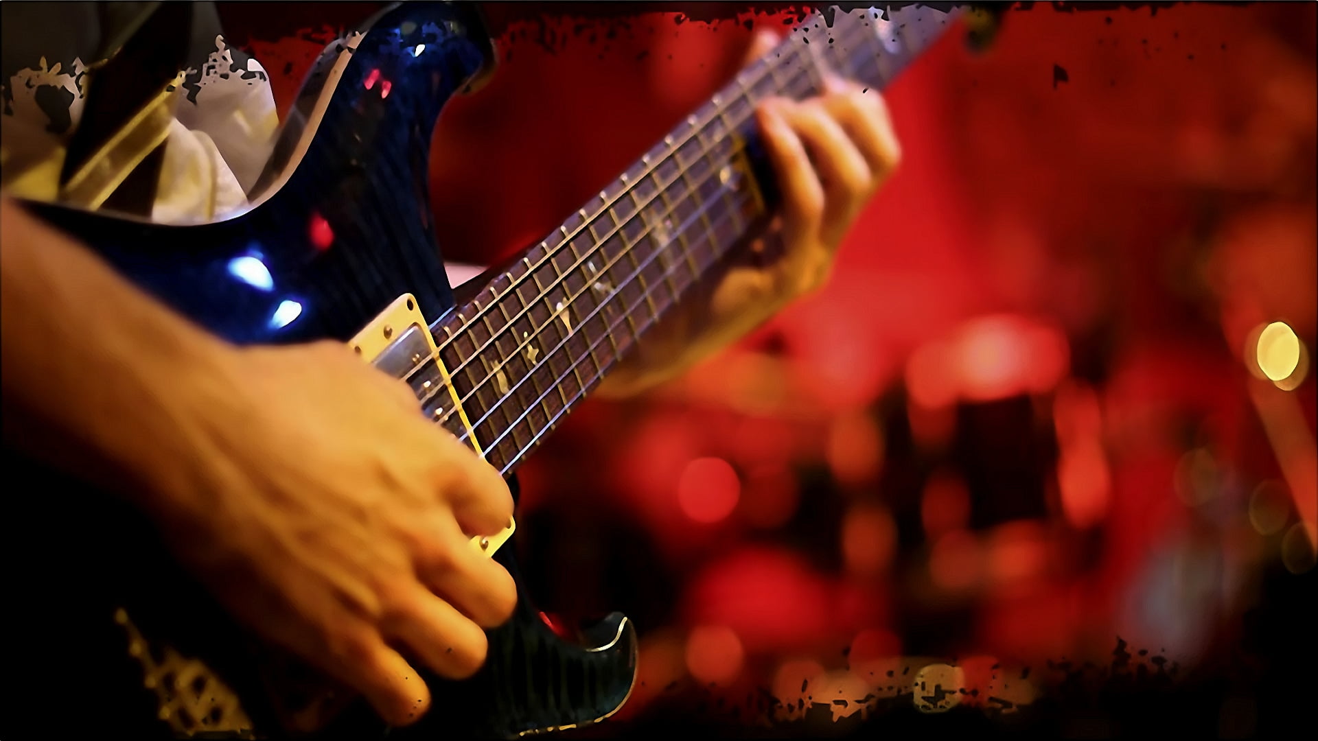 man playing black electric guitar