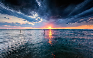 body of water, water, sunset, storm