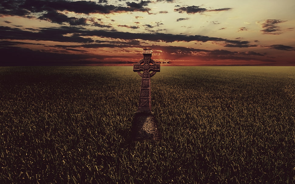 landscape photography of green field with cross statue during golden hour HD wallpaper