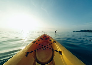 photography of yellow kayak on clear body of water HD wallpaper