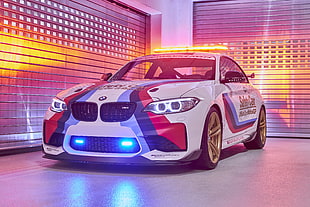 white and red BMW racing car