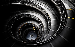 photo of gray and black spiral stairs