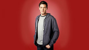 man in grey zip-up jacket with red background illustration