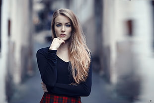 selective focus photography of woman wears black long-sleeved blouse