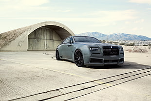 gray Rolls Royce Wraith coupe near building during daytime HD wallpaper