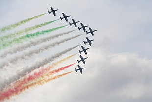jet planes doing air show showing colored smoke