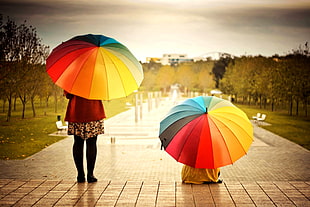 woman in red and black dress holding umbrella during daytime HD wallpaper