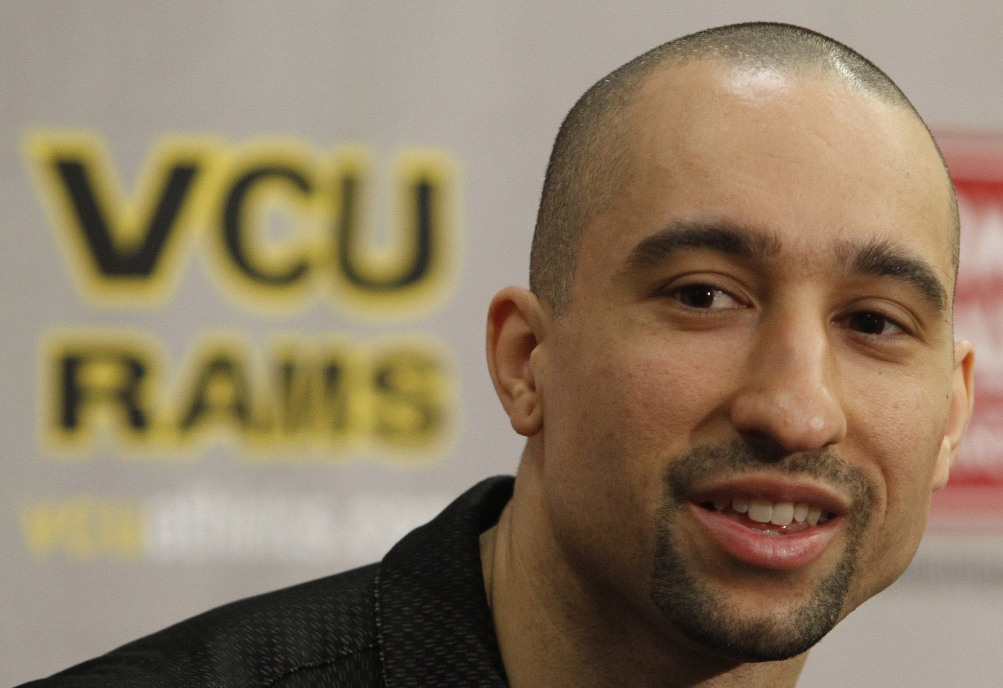 man wearing black collared shirt