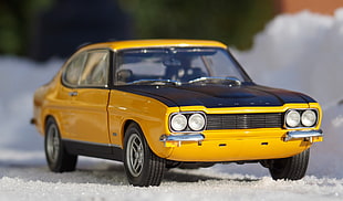yellow and black Ford coupe die-cast model