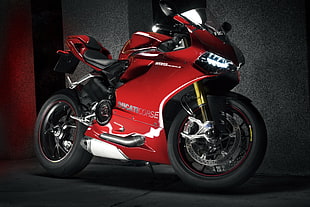 red and black sports bike near gray painted wall HD wallpaper