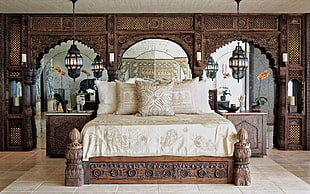 brown wooden bed with white bedspread