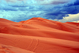 clouds over sand dunes HD wallpaper
