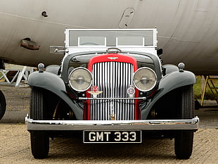 photo of a classic black and red vehicle