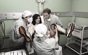 woman wearing sneakers while giving birth