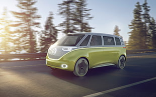 time lapse photo of yellow Volkswagen concept van running on road during daytime