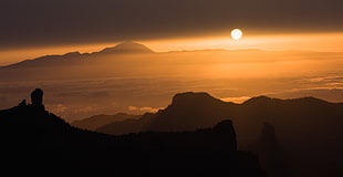 silhouette of mountains under calm sky during golden hour, el teide