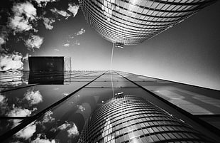 gray scale photo and worms eye view of two buildings HD wallpaper