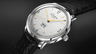 closeup photo of round silver-colored analog watch with black leather strap HD wallpaper