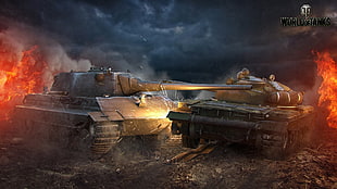 two brown battle tanks firing during night time