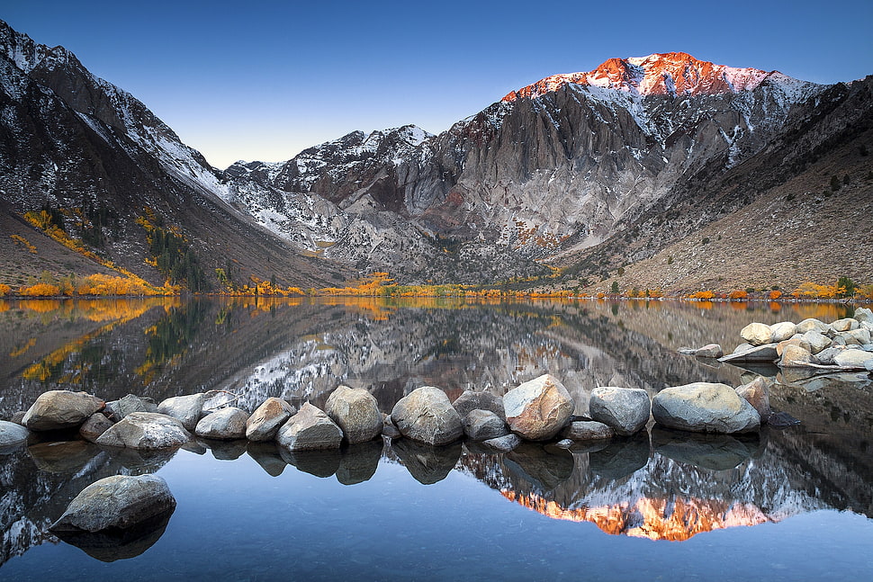 snow covered mountain near river during daytime HD wallpaper