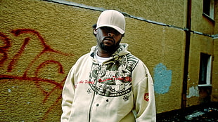 man in white and gray full-zip hoodie and cap