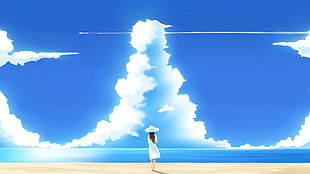 woman in white dress and white sun hat on sea shore under blue sky