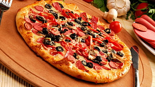 pepperoni pizza on top of wooden board beside stainless steel knife HD wallpaper