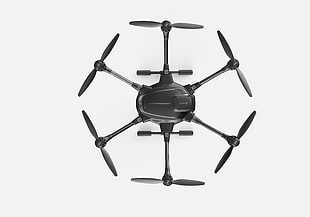 black quadcopter while flying HD wallpaper
